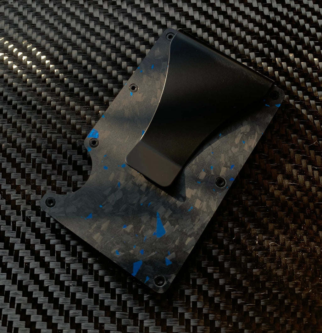 Carbon fiber plate with blue specks on a carbon fiber background